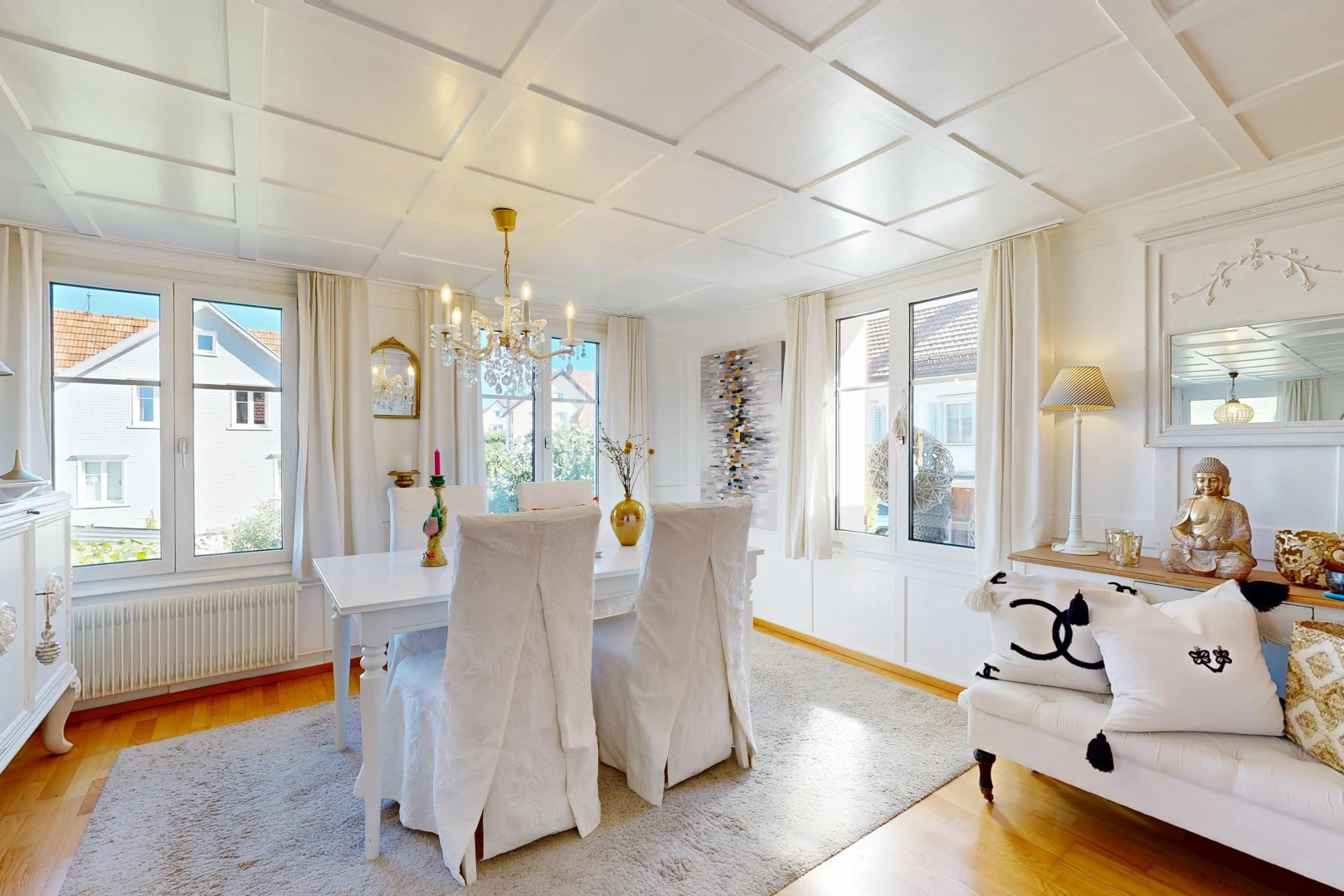 dining room with coffered ceiling, radiator heating unit, and light wood-style flooring