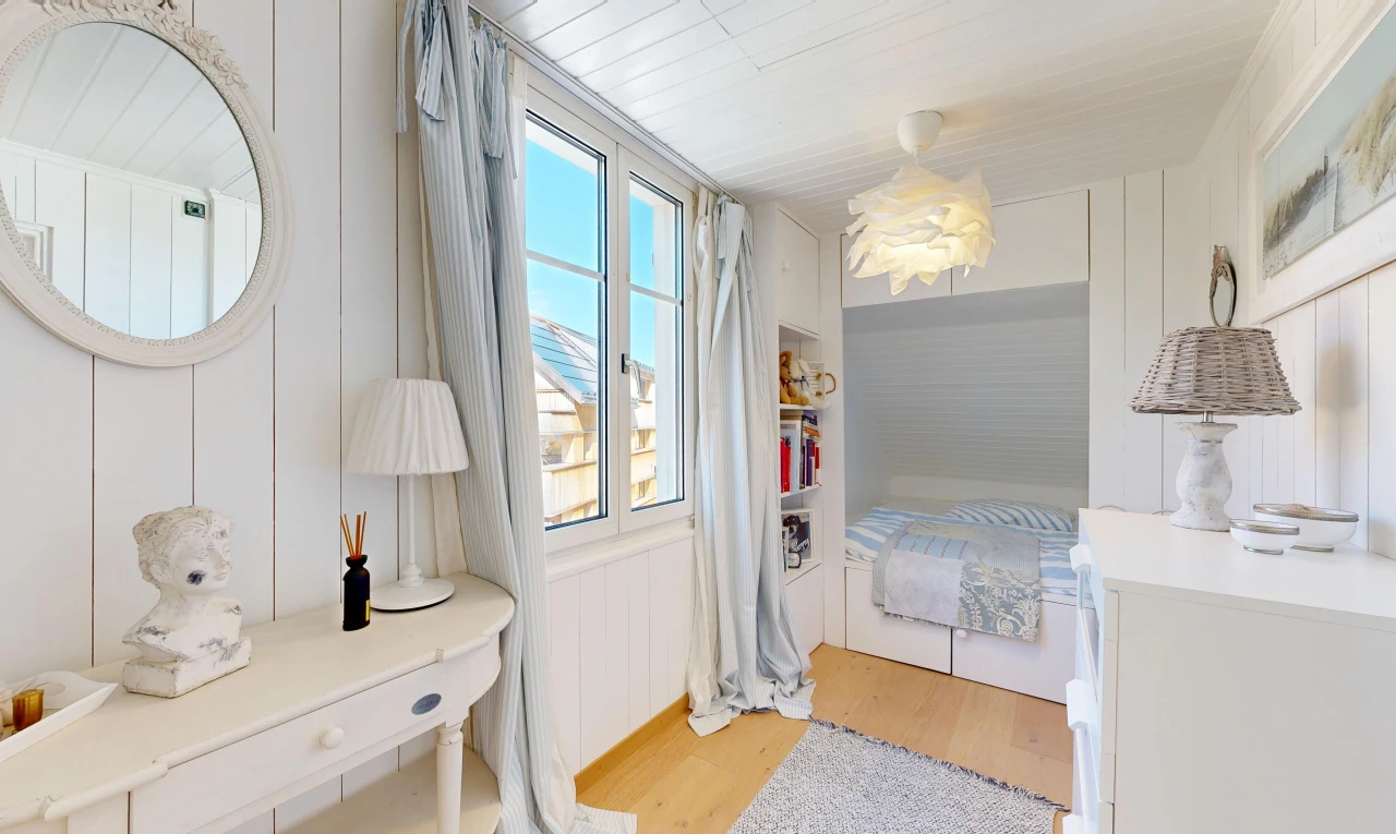room / bedroom with light wood-style flooring and wooden walls
