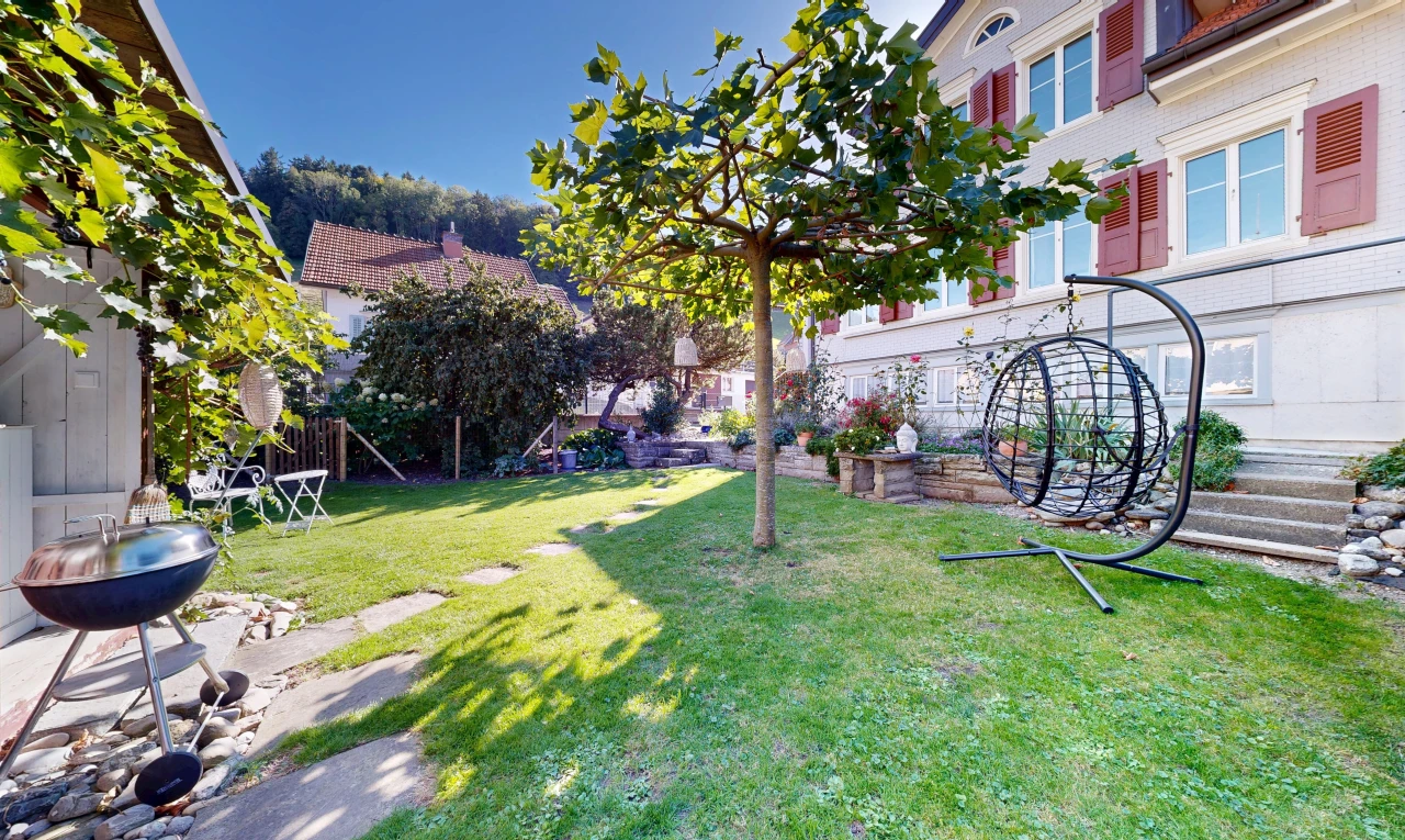 garden featuring a grill and a lawn