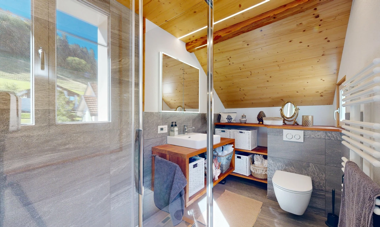 bathroom with tile walls, a vaulted wood ceiling, vanity, and a shower with shower door
