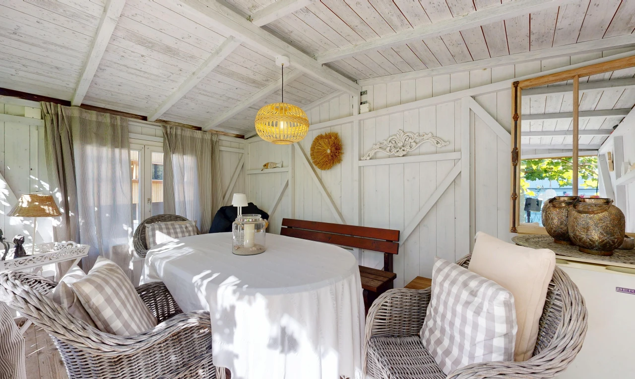 dining area with vaulted ceiling with beams, wooden ceiling, and pendant lighting