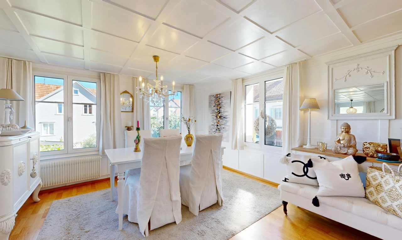 dining room with coffered ceiling, radiator heating unit, and light wood-style flooring
