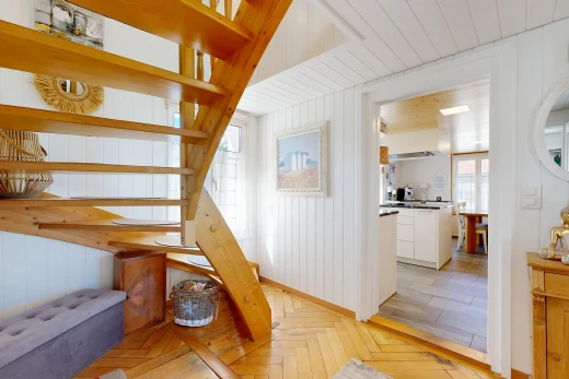 staircase featuring parquet floors and wood walls