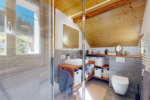 bathroom with tile walls, a vaulted wood ceiling, vanity, and a shower with shower door