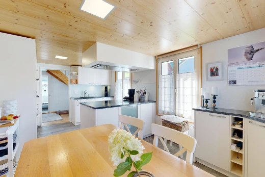 kitchen featuring dark countertops, wood ceiling, open shelves, white cabinetry, and access to outside