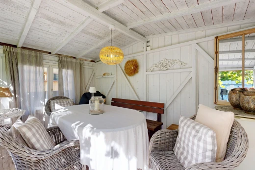 dining area with vaulted ceiling with beams, wooden ceiling, and pendant lighting
