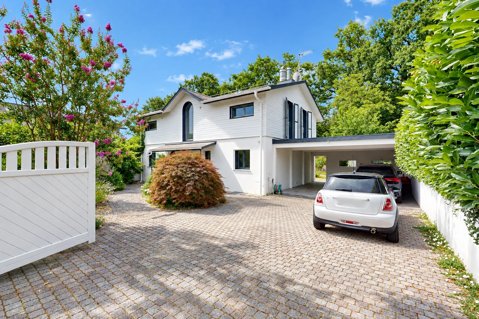 view of property featuring driveway and a carport