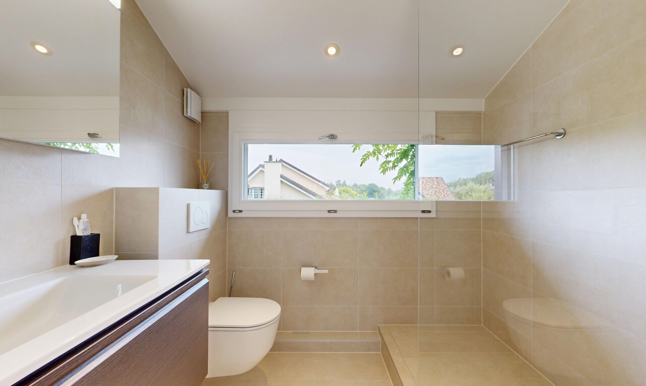 bathroom featuring tile walls, vanity, walk in shower, and recessed lighting