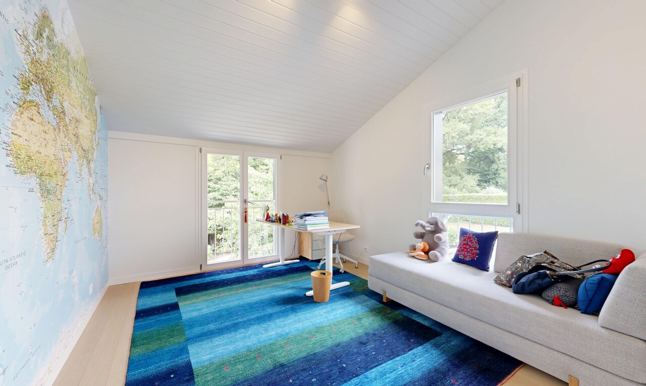 living room featuring lofted ceiling and access to outside