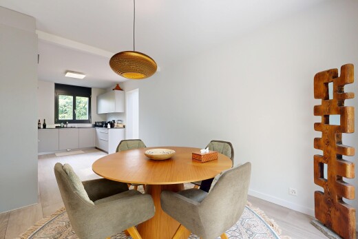 dining room with hanging light fixtures and light wood-type flooring