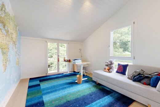 living room featuring lofted ceiling and access to outside