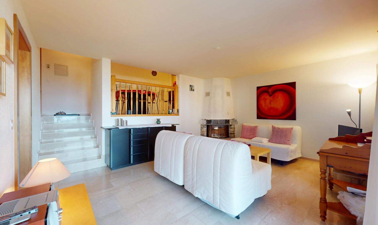 living room featuring stairs