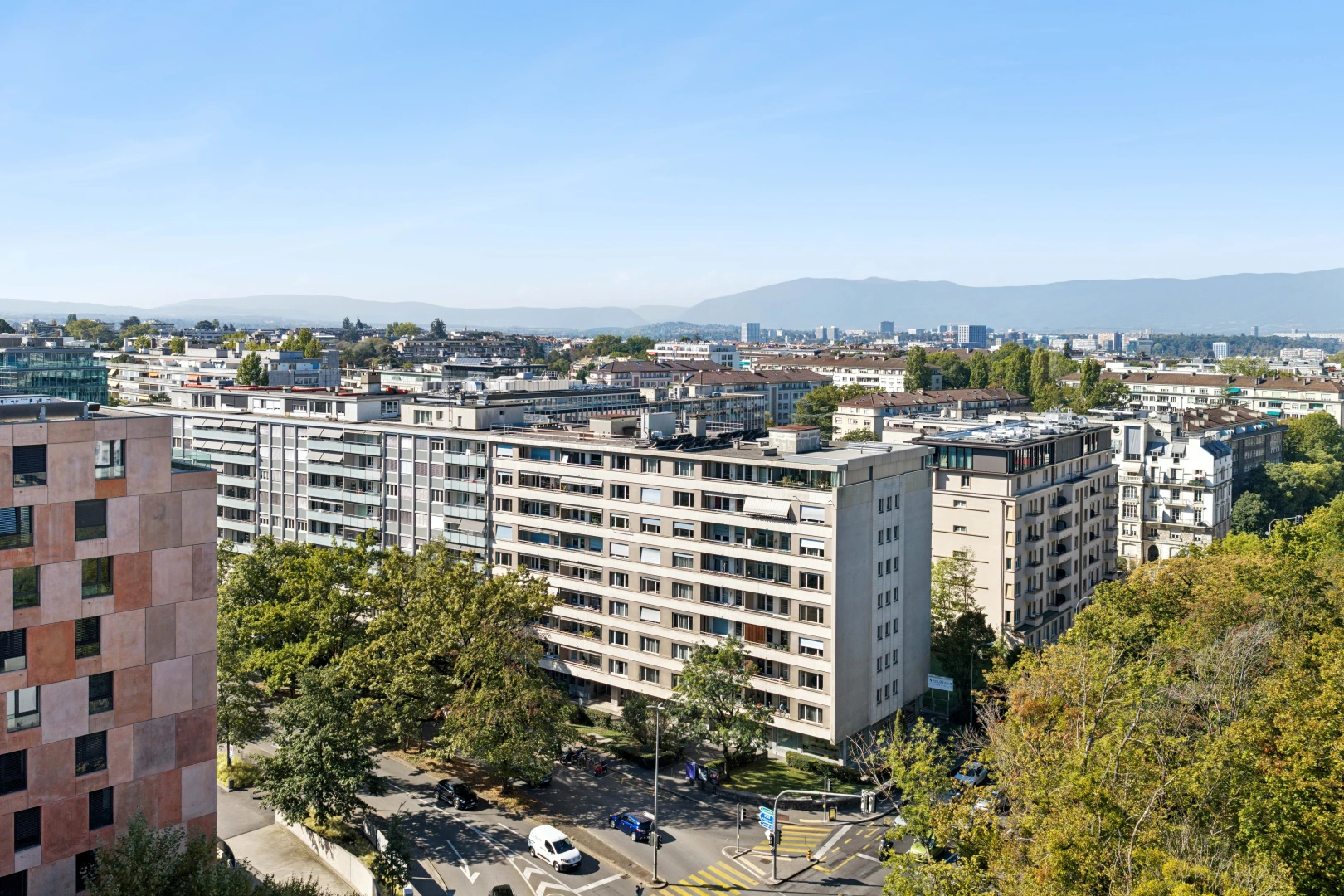 view of apartment building / complex with street lights and a mountain view