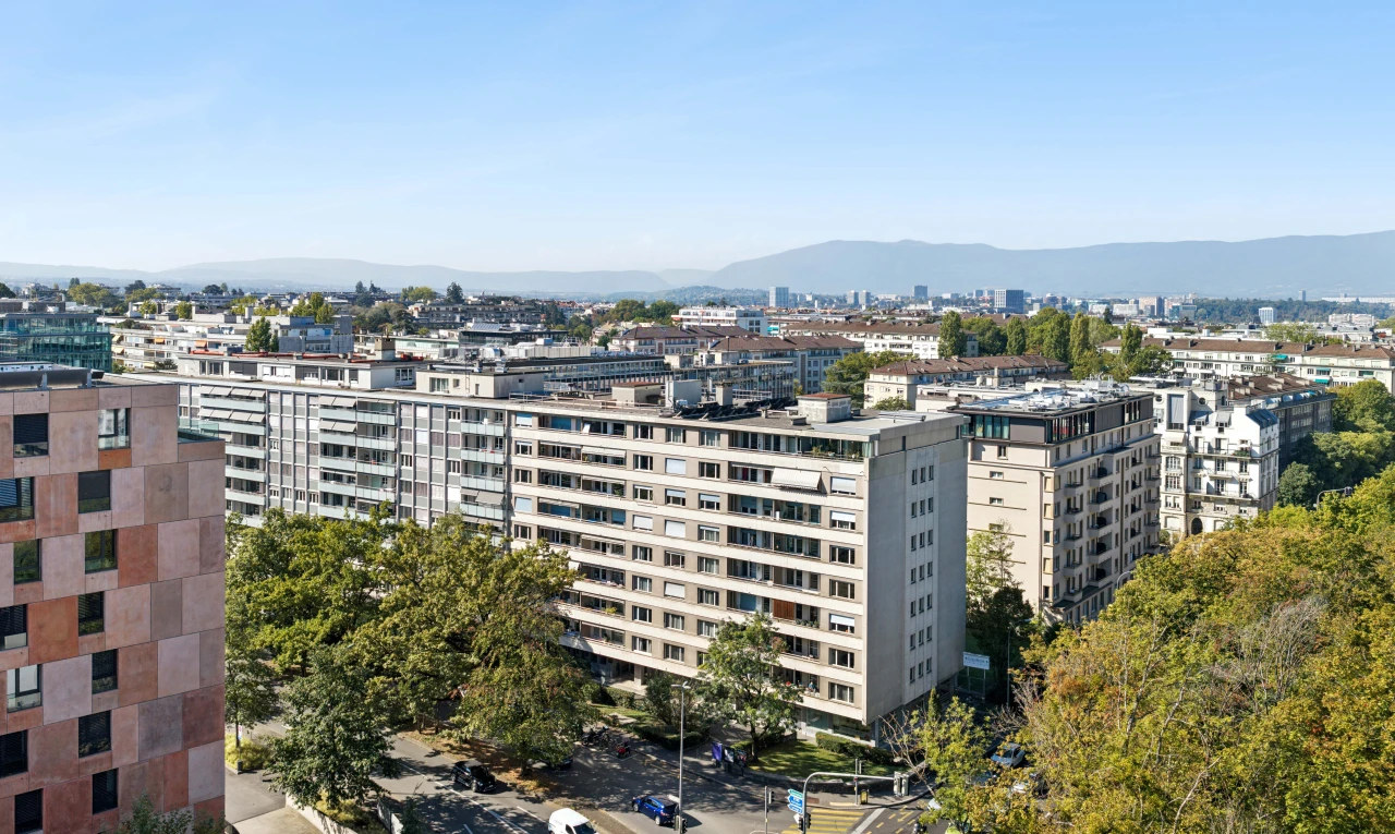 view of apartment building / complex with street lights and a mountain view
