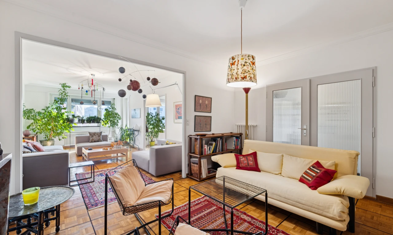living area with access to exterior, crown molding, french doors, and parquet floors