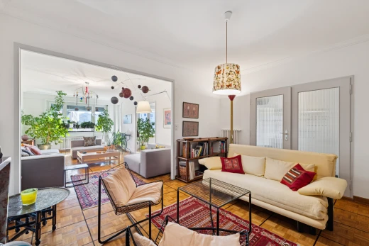 living area with access to exterior, crown molding, french doors, and parquet floors