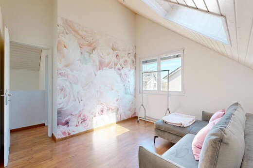 living area with wood finished floors, a vaulted wooden ceiling, and a skylight