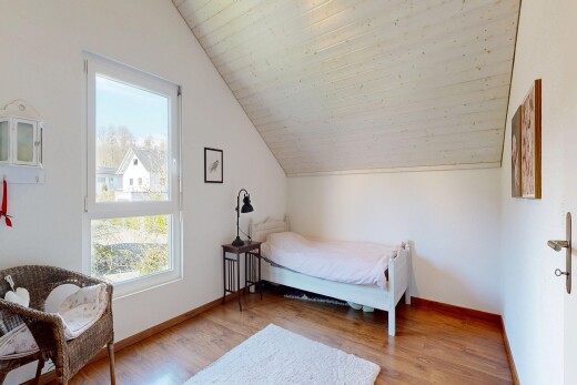 room with light wood finished floors and lofted ceiling