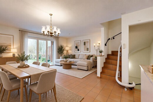 salon / salle à manger avec escaliers, accès à l'extérieur, drywall, cloison sèche, et wood finish stairs