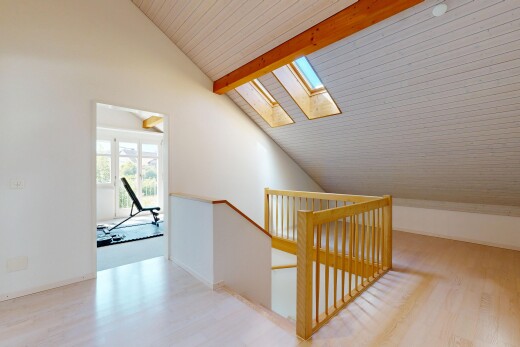 treppe mit inside property, balkendecke, beamed ceiling, holzfußboden, und wood finish floor