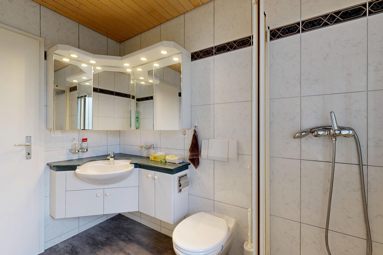 bathroom with vanity, tile walls, a stall shower, and wood ceiling