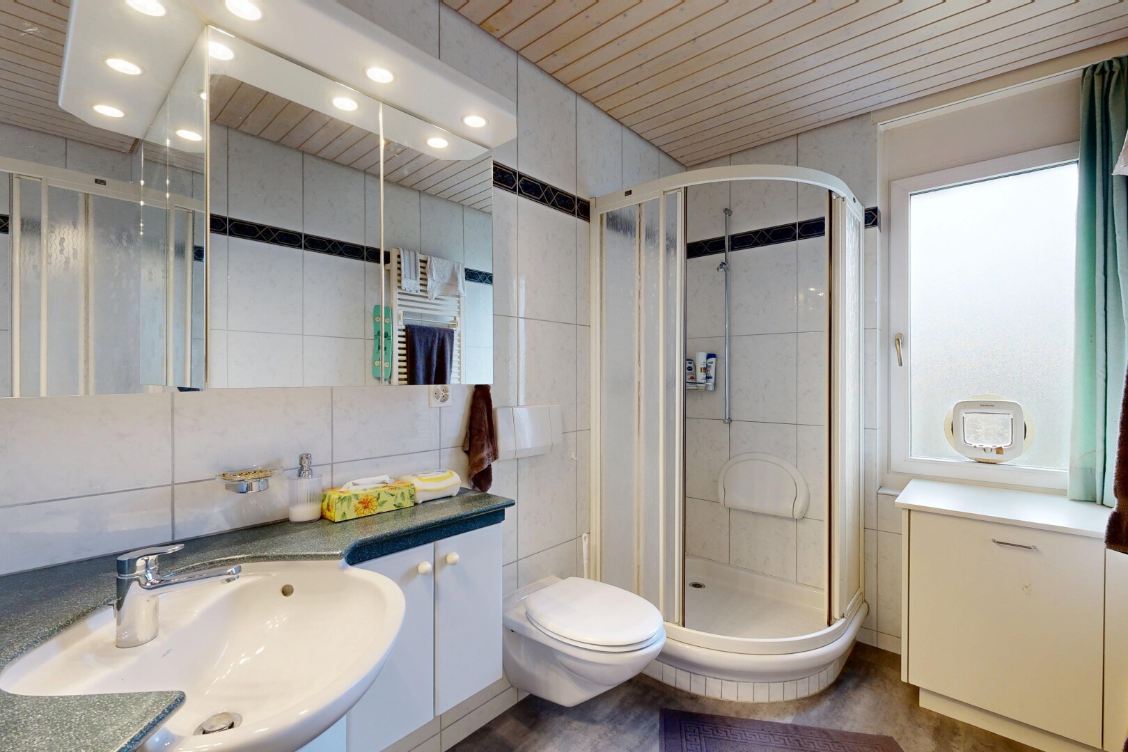 full bath with tile walls, a shower stall, vanity, and wood ceiling
