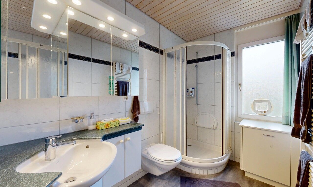 full bath with tile walls, a shower stall, vanity, and wood ceiling