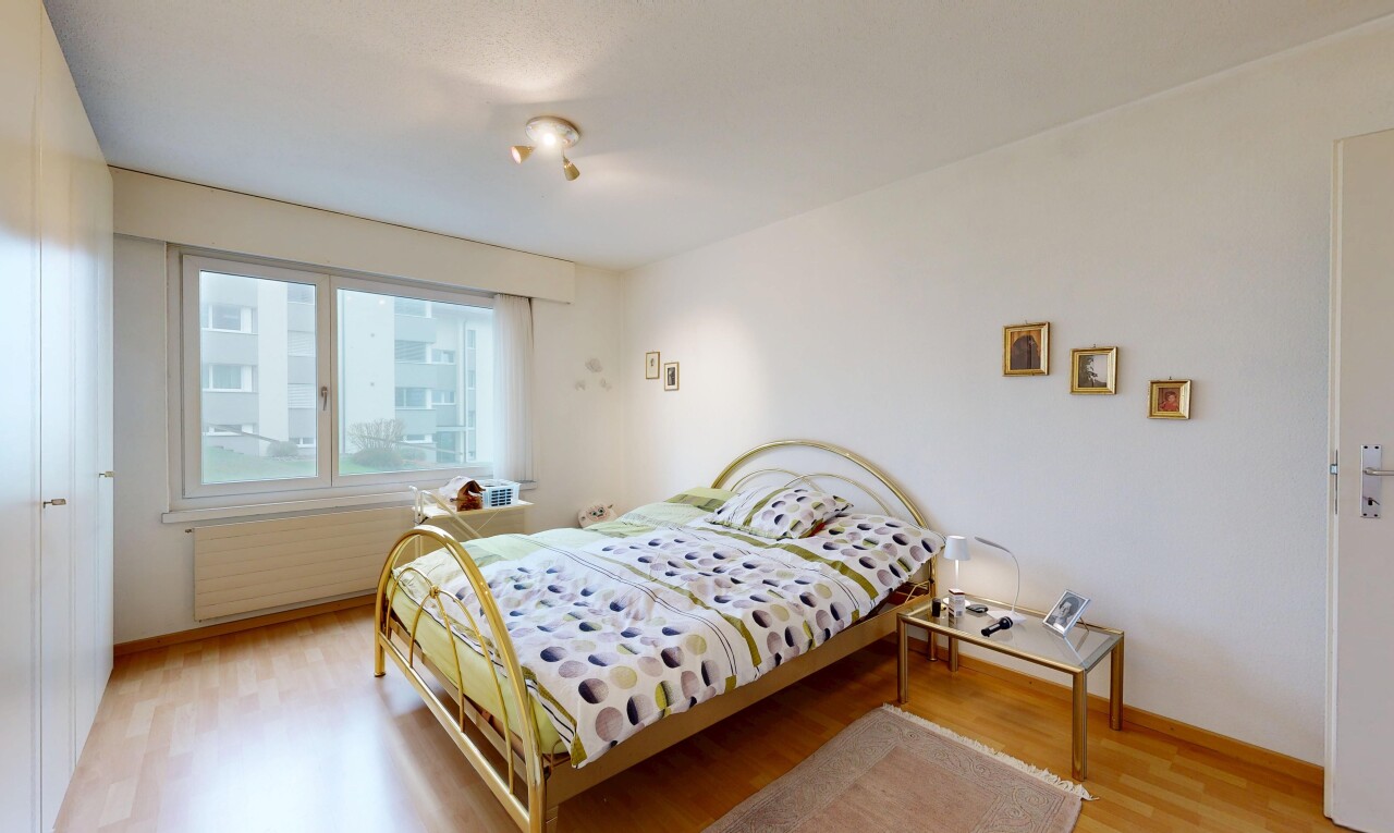 room / bedroom with light wood-style flooring and radiator heating unit