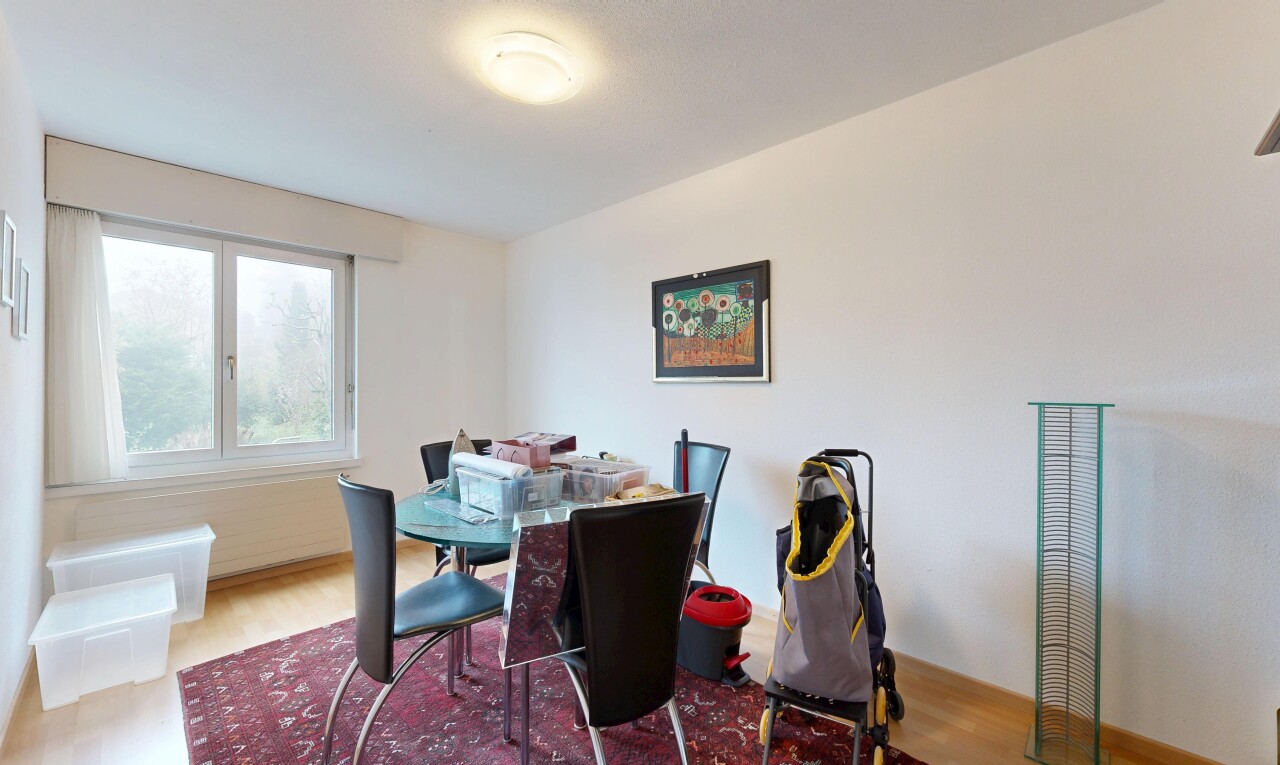 dining space with wood finished floors