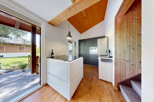 küche mit außenzugang, carpet stairs, vaulted ceiling, dachschräge, und wood finish floor