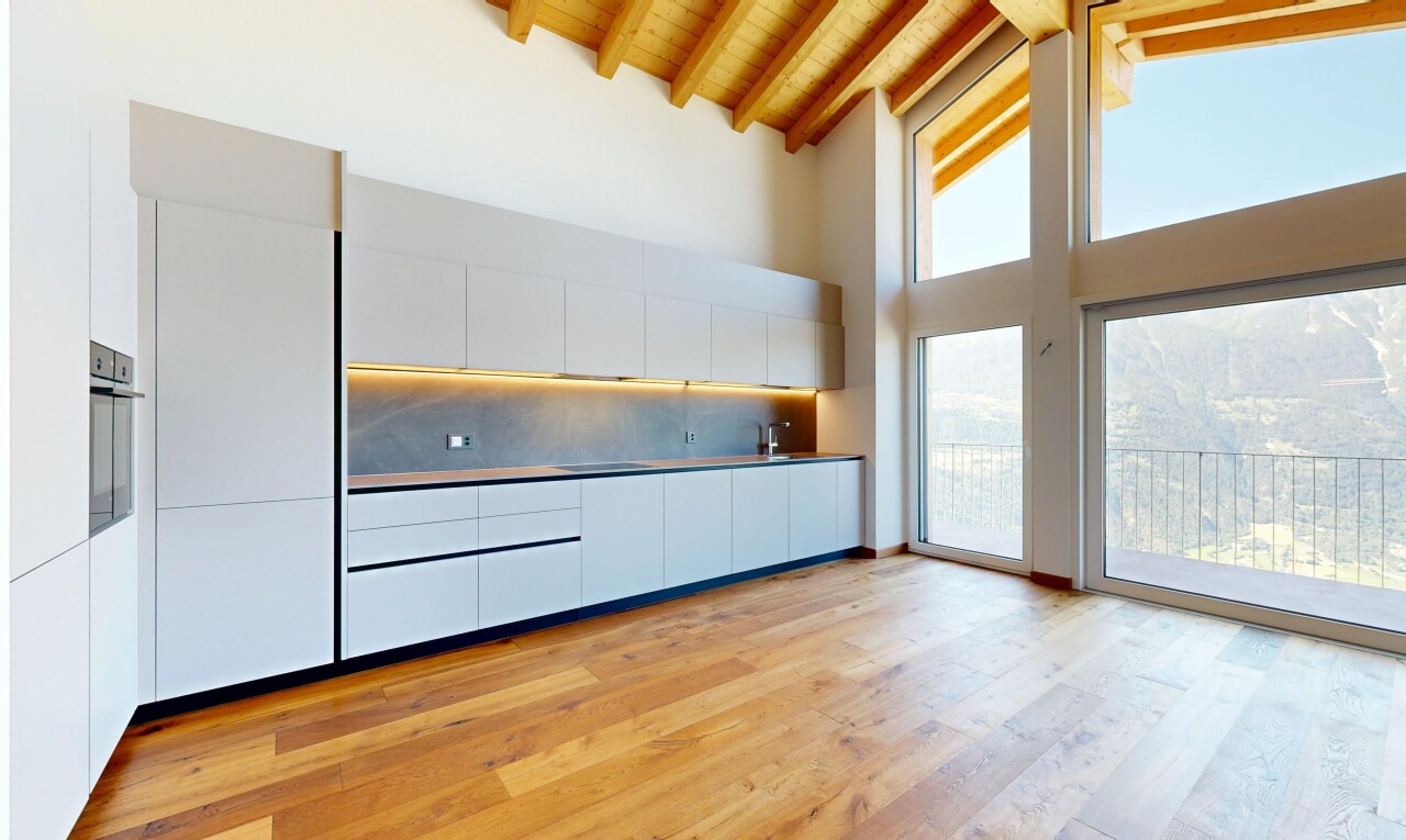küche mit flat panel cabinets, schränke mit flachen paneelen, holzfußboden, wood finish floor, und dachschräge