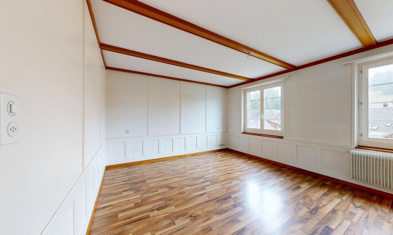 leerer raum mit paneling wall, wandvertäfelung, kühler, inside property, und wood finish floor