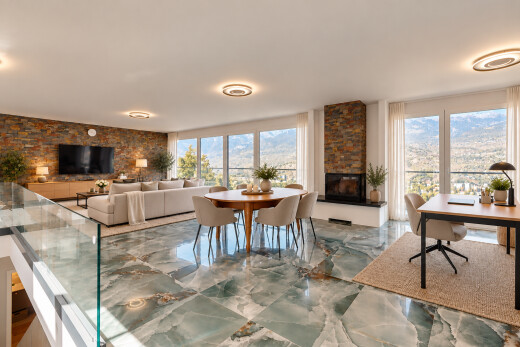salon / salle à manger avec cheminée, stone wall, mur en pierre, télévision, et marble finish floor