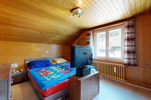 room featuring wood walls, radiator, and a vaulted wood ceiling
