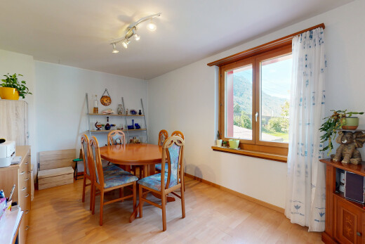 dining room with rail lighting and light wood-style floors