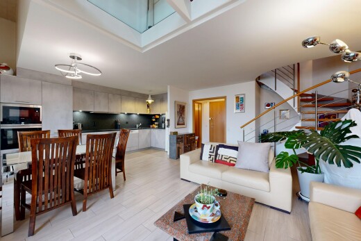 living / dining room featuring stairway