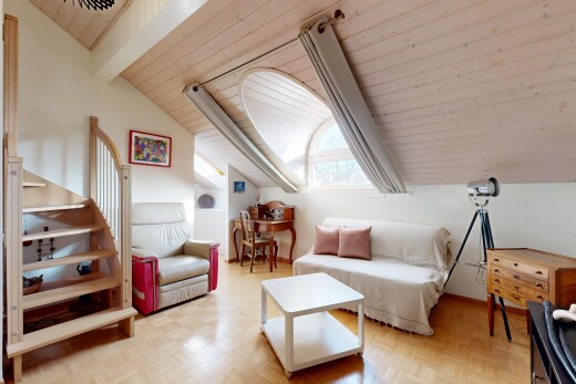 living area with lofted ceiling and wood ceiling