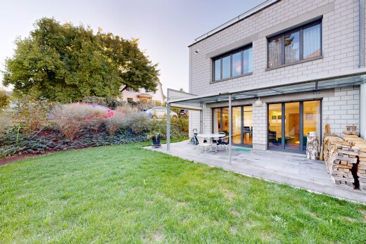 outdoor house with a yard and a patio