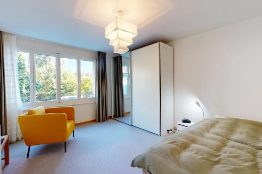 chambre avec cloison sèche, drywall, moquette, carpet, et inside property