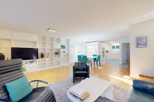 living / dining area featuring built in features and light wood-style flooring