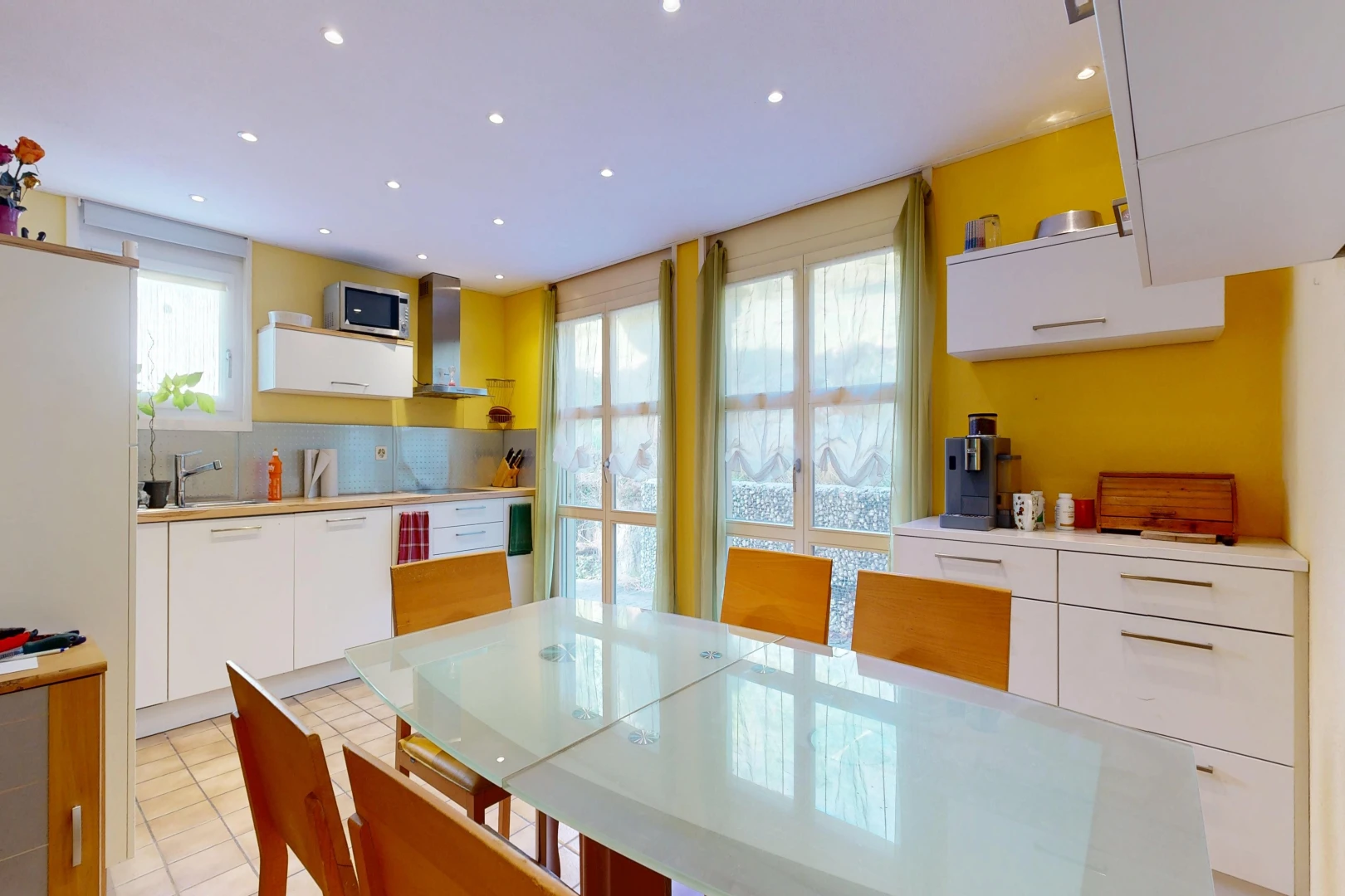 kitchen with recessed lighting, white cabinets, light countertops, and plenty of natural light