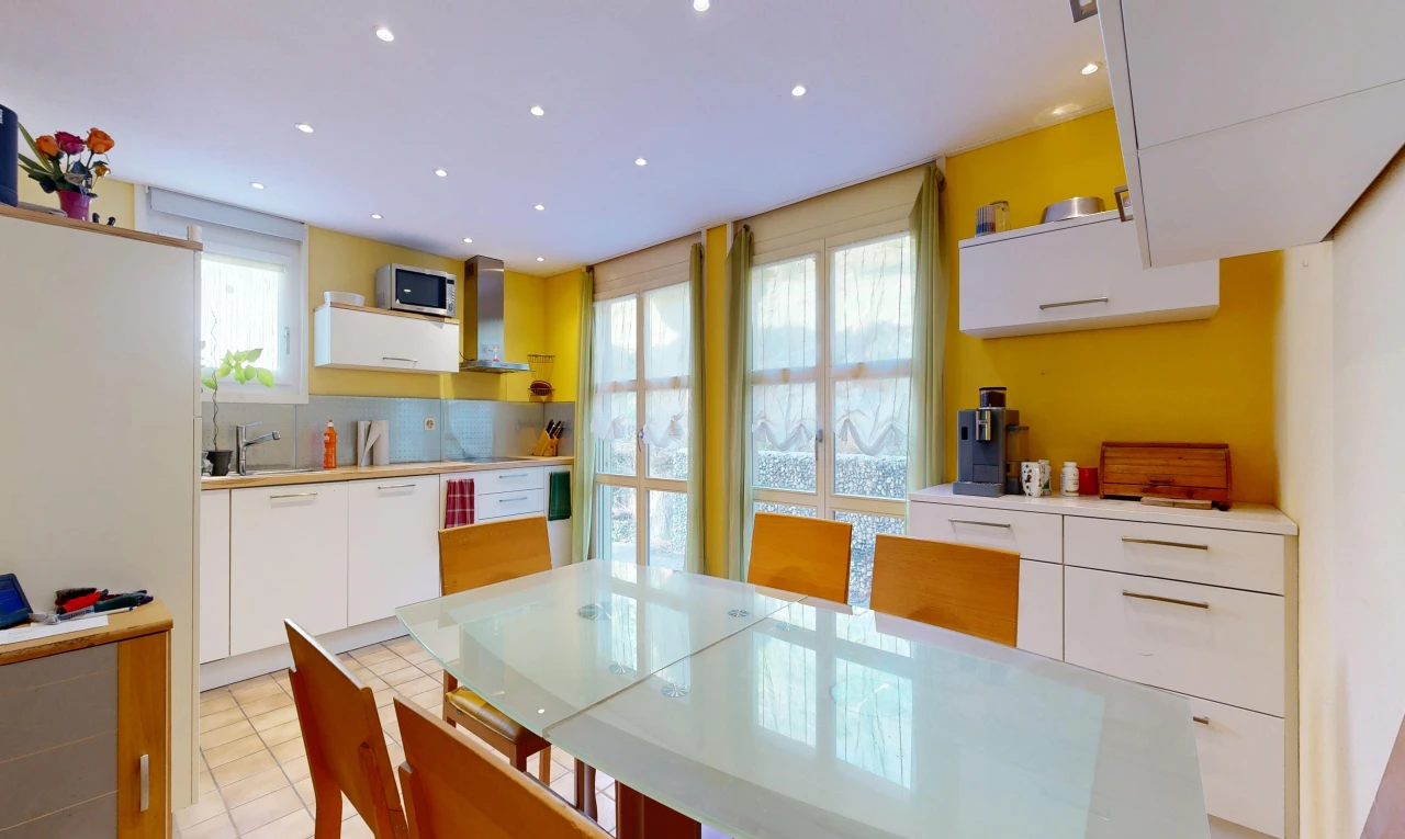 kitchen with recessed lighting, white cabinets, light countertops, and plenty of natural light