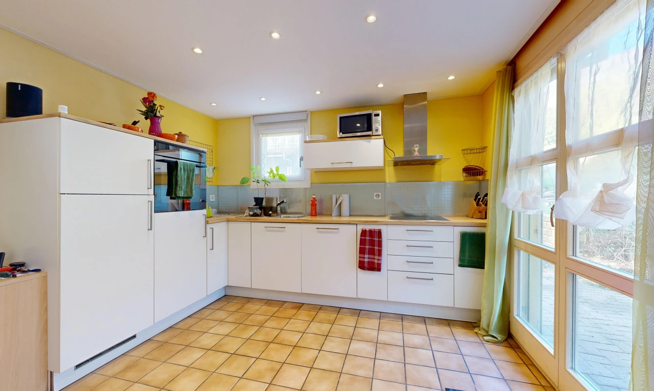 kitchen featuring light countertops, recessed lighting, black appliances, and white cabinetry