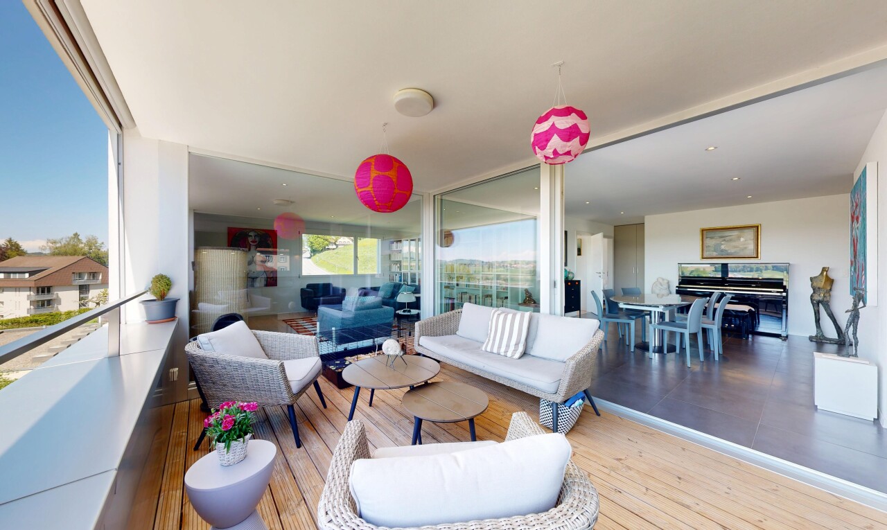patio / terrace with an outdoor living / dining area