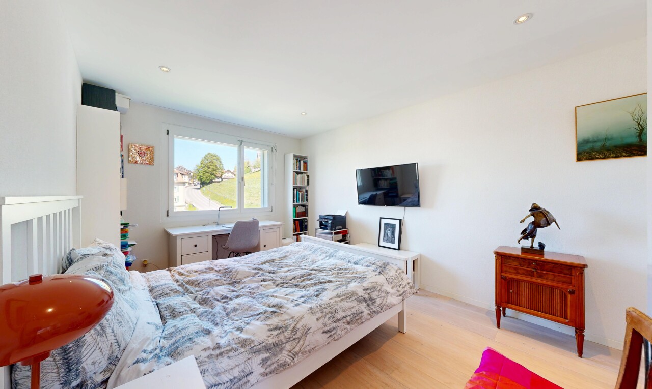 room with light wood-style floors and recessed lighting