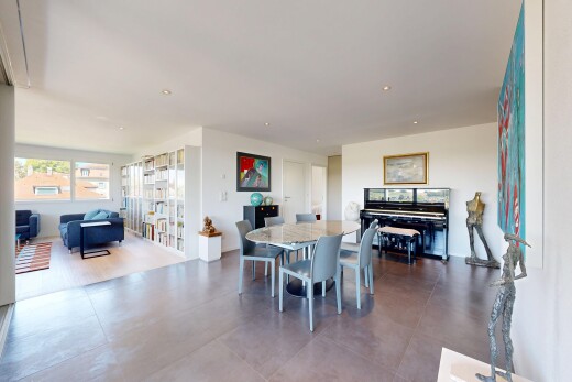 living / dining area with recessed lighting
