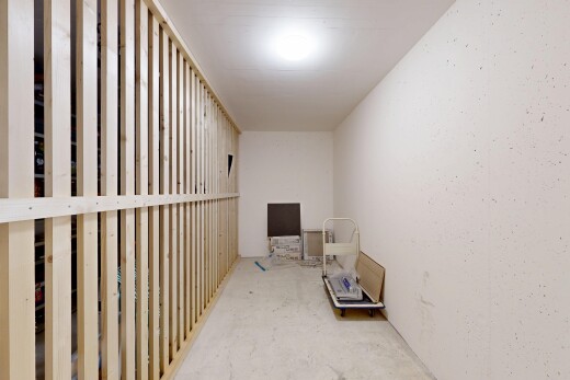 halle / korridor mit concrete floor, betonboden, unfinished concrete floor, drywall, und gipskartonwand