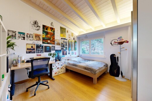 room with light wood-style floors, an office area, and wooden ceiling