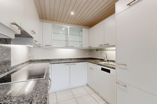 küche mit dark countertops, stein arbeitsplatten, stone countertops, light floor, und holzdecke