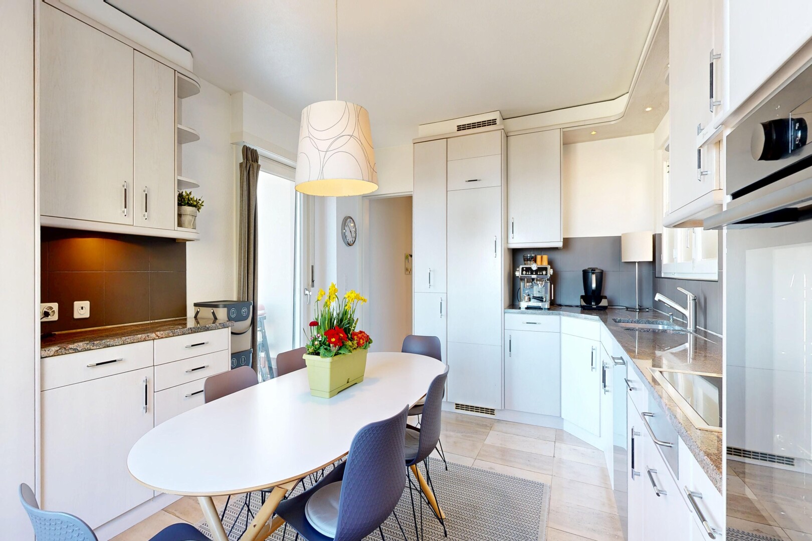 kitchen with stainless steel oven, white cabinetry, black electric cooktop, open shelves, and dark stone countertops